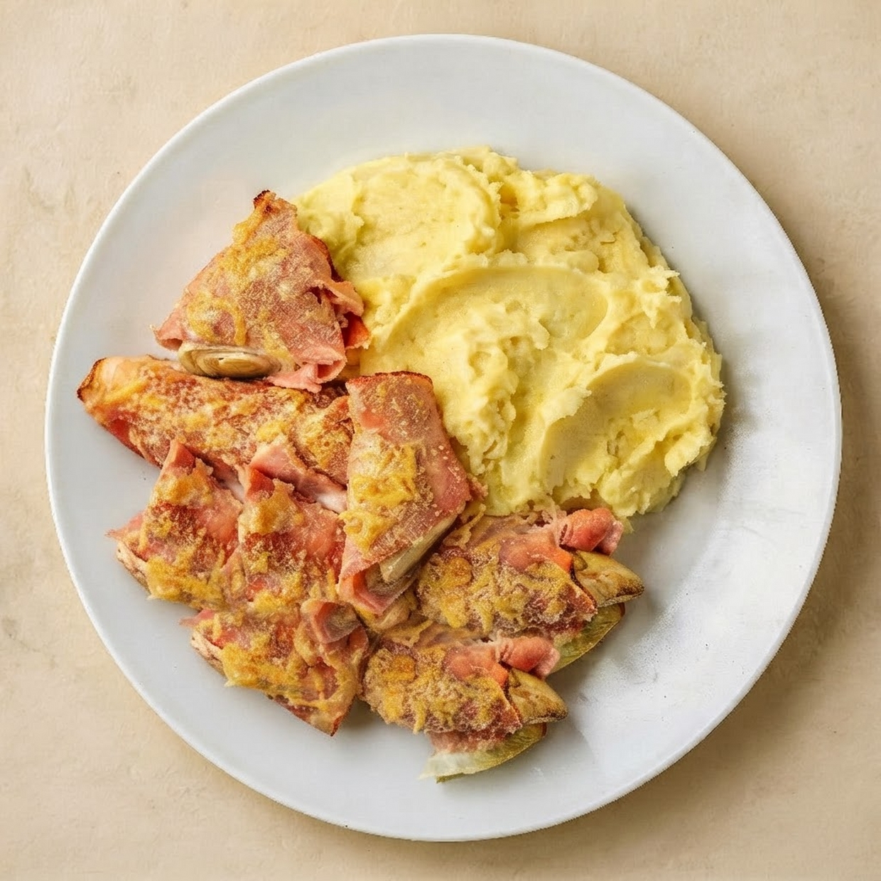 Witlofrolletjes met ham/kaas en aardappelpuree
